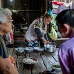 Jan 26, 2023 - Poipet, Banteay Meanchey Province, Cambodia. Sum Srey Oun prepares dinner for her parents in law in the evening. Photo: UN Women/Nicholas Axelrod