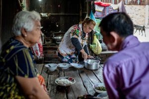 Jan 26, 2023 - Poipet, Banteay Meanchey Province, Cambodia. Sum Srey Oun prepares dinner for her parents in law in the evening. Photo: UN Women/Nicholas Axelrod